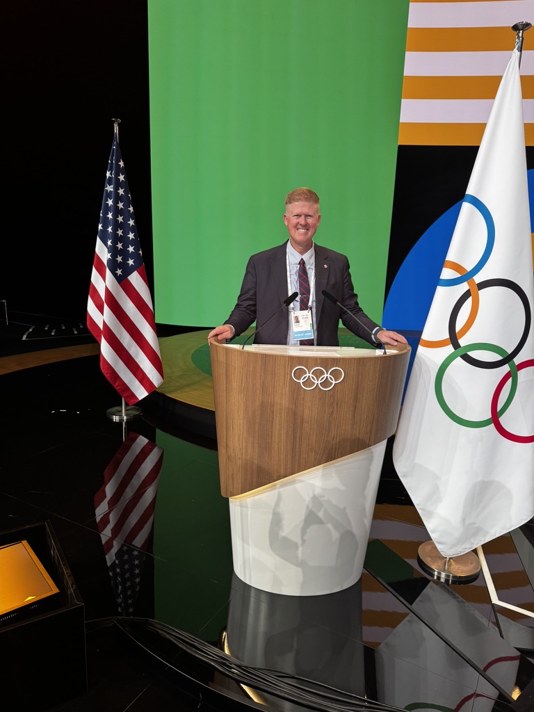 Jon Hawkins speaking at a podium